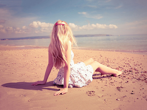 Girl Sitting on Beach